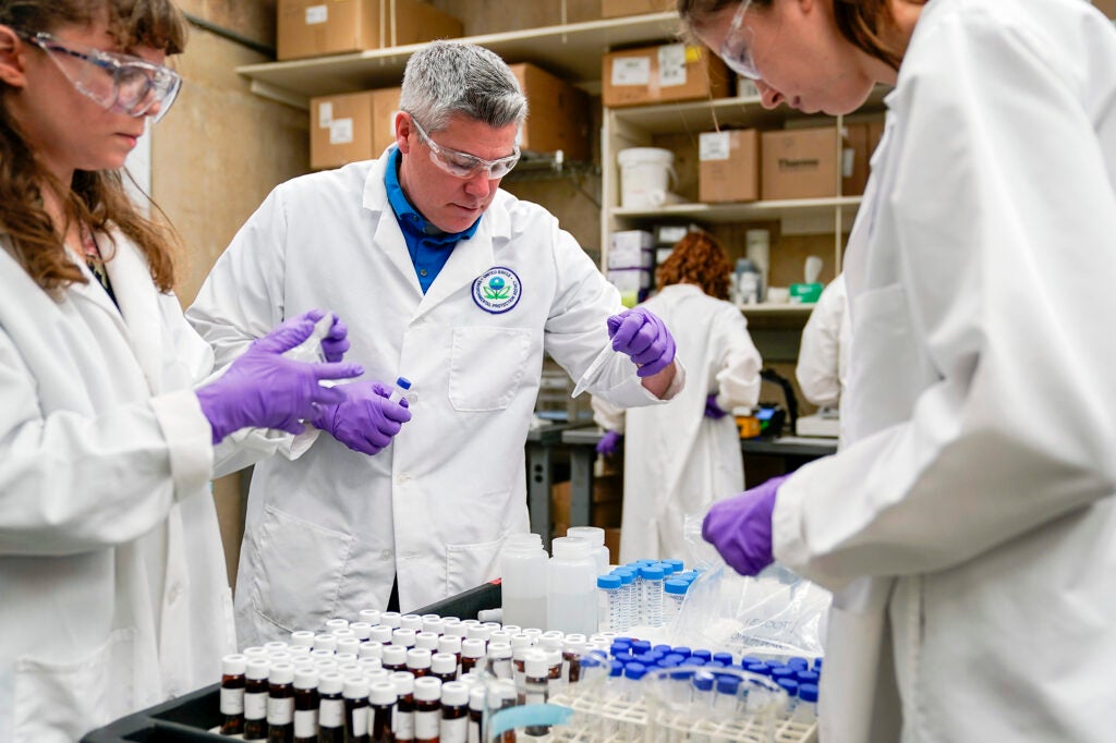 Environmental Protection Agency scientists sort samples for experimentation as part of drinking water and PFAS research at the EPA Center For Environmental Solutions and Emergency Response in Cincinnati. (Joshua A. Bickel / AP)